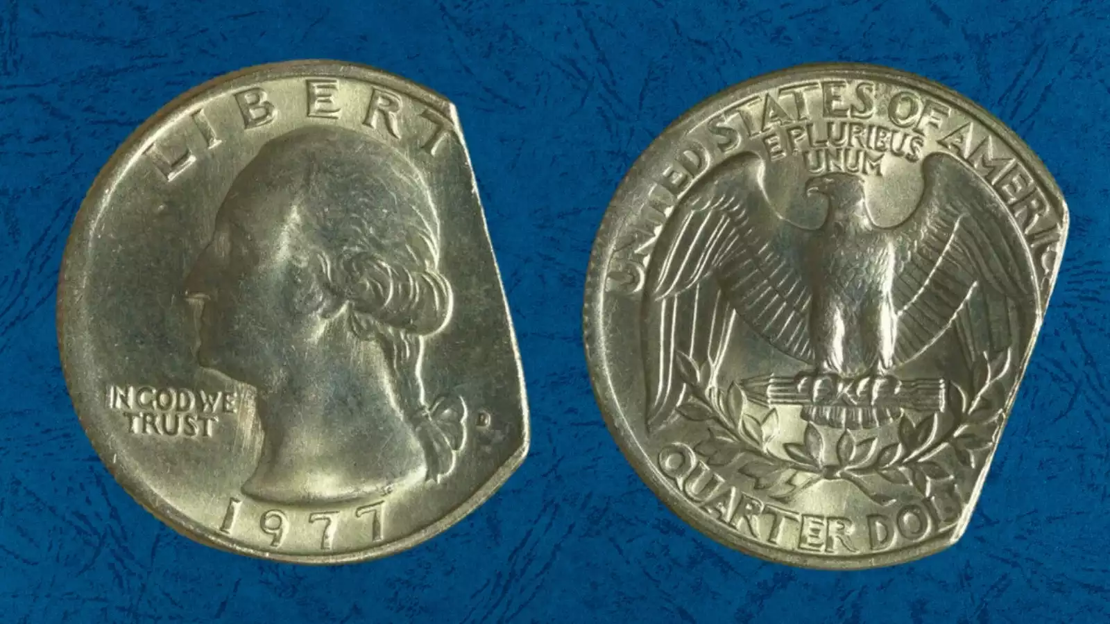 1977-D quarter struck on cent planchet showing small reddish-bronze coin with truncated quarter design